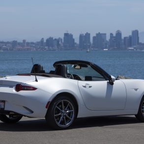 Three-quarter rear view of a 2024 white Mazda MX-5 Miata RF