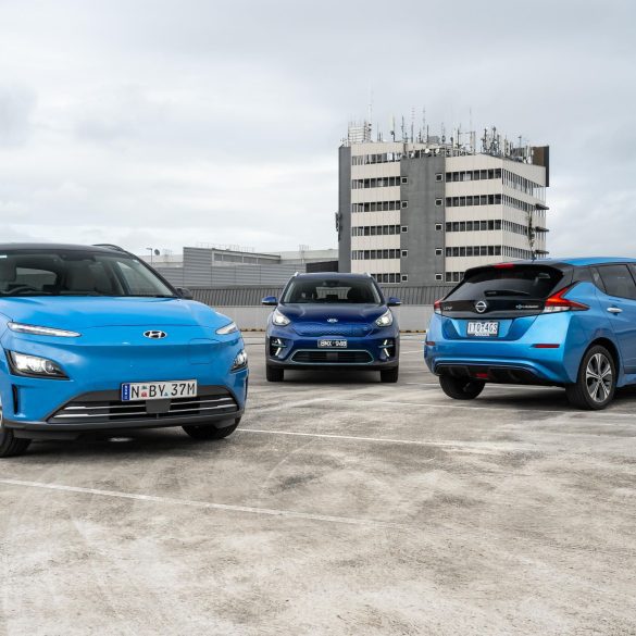 Image showing three blue electric vehicles - Hyundai Kona, Kia Niro and Nissan Leaf.