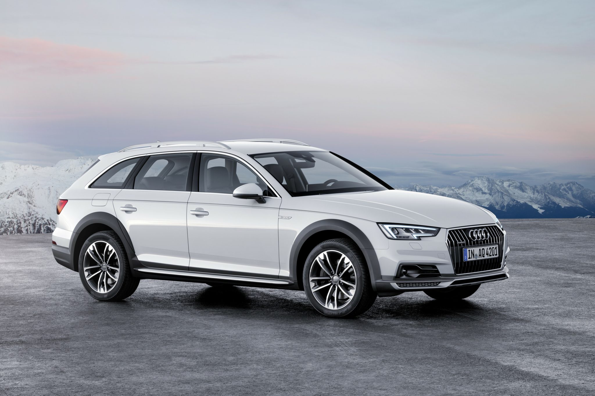 Three-quarter side view of a 2024 white Audi A4 allroad quattro