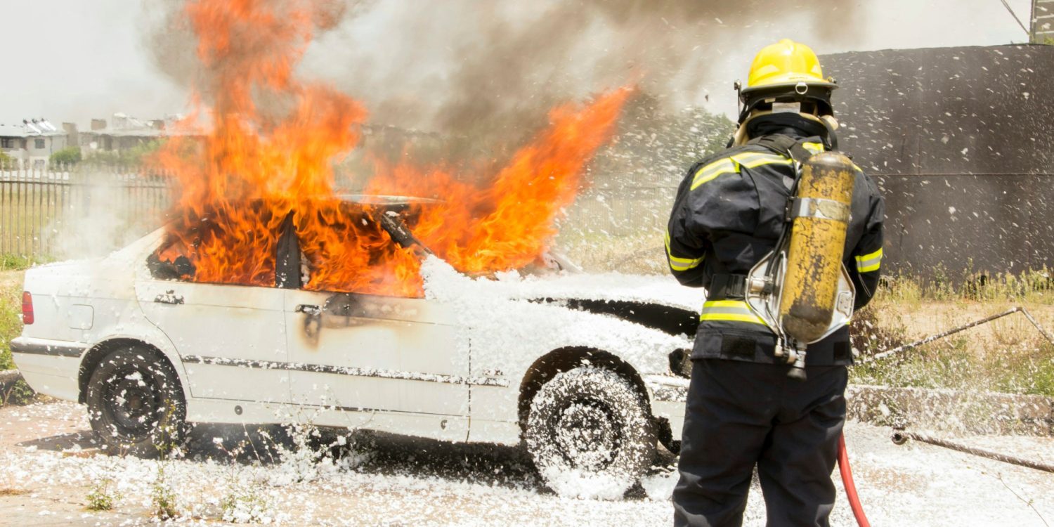 Firefighting putting out a car fire