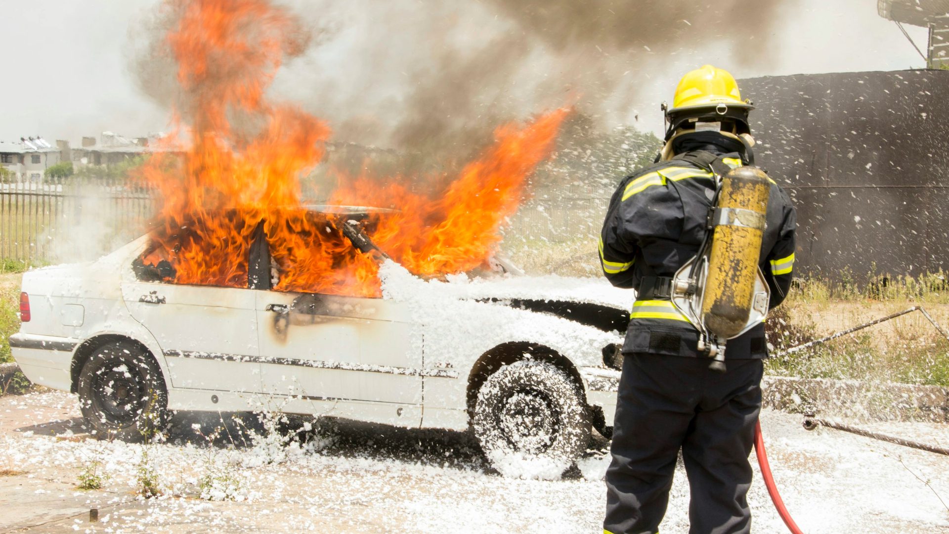 Firefighting putting out a car fire