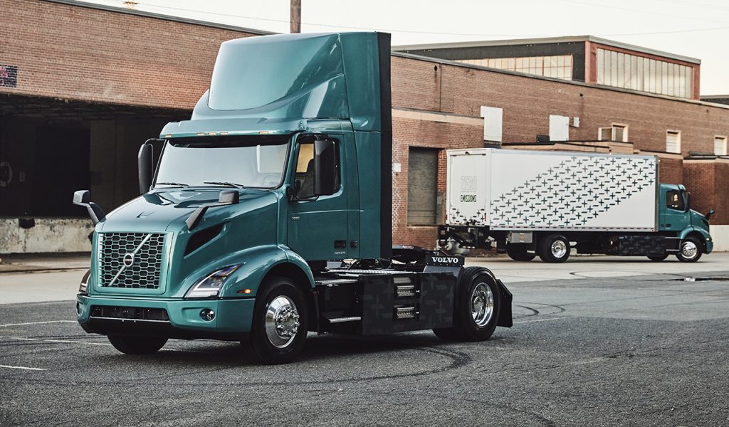 Volvo VNR Electric 4x2 Semi-tractor and 4x2 straight truck in the back