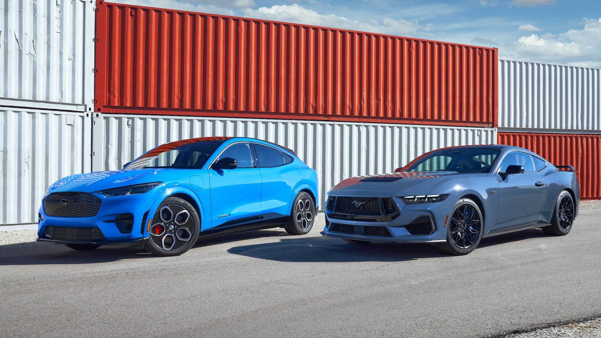 Three-quarter side view of a blue Mustang Mach-E and Mustang GT